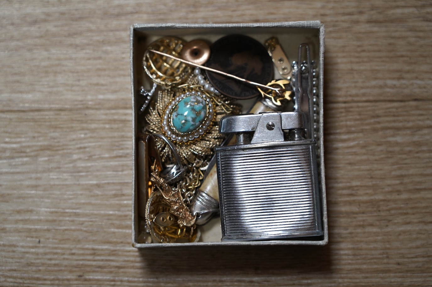 Assorted jewellery and other items including a 1970's 9ct gold Cavalier charm, 30mm, 5.9 grams, a 14k tram charm, 1.7 grams, a 9ct and enamel Esso badge, a yellow metal stick pin, marcasite and costume, lighter penknife,